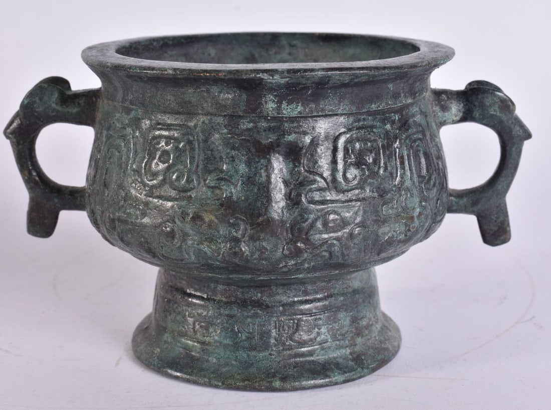 A CHINESE TWIN HANDLED BRONZE CENSER. 14 cm wide, internal width 8 cm. (1 of 5)