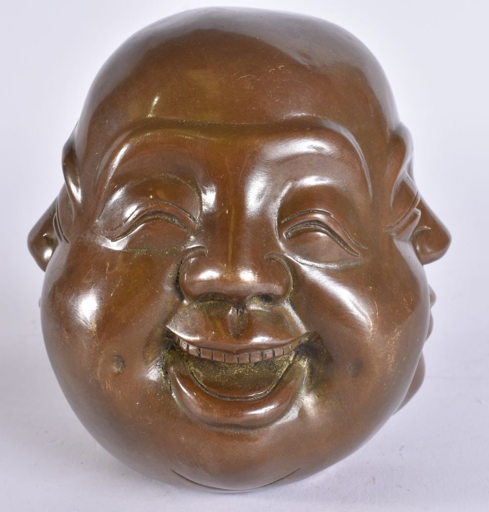 A CHINESE BRONZE BUDDHA HEAD. 11 cm x 8 cm.: A CHINESE BRONZE BUDDHA HEAD. 11 cm x 8 cm.