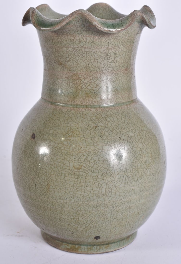 A CHINESE CELADON GLAZED POTTERY VASE. 18 cm high. (1 of 4)