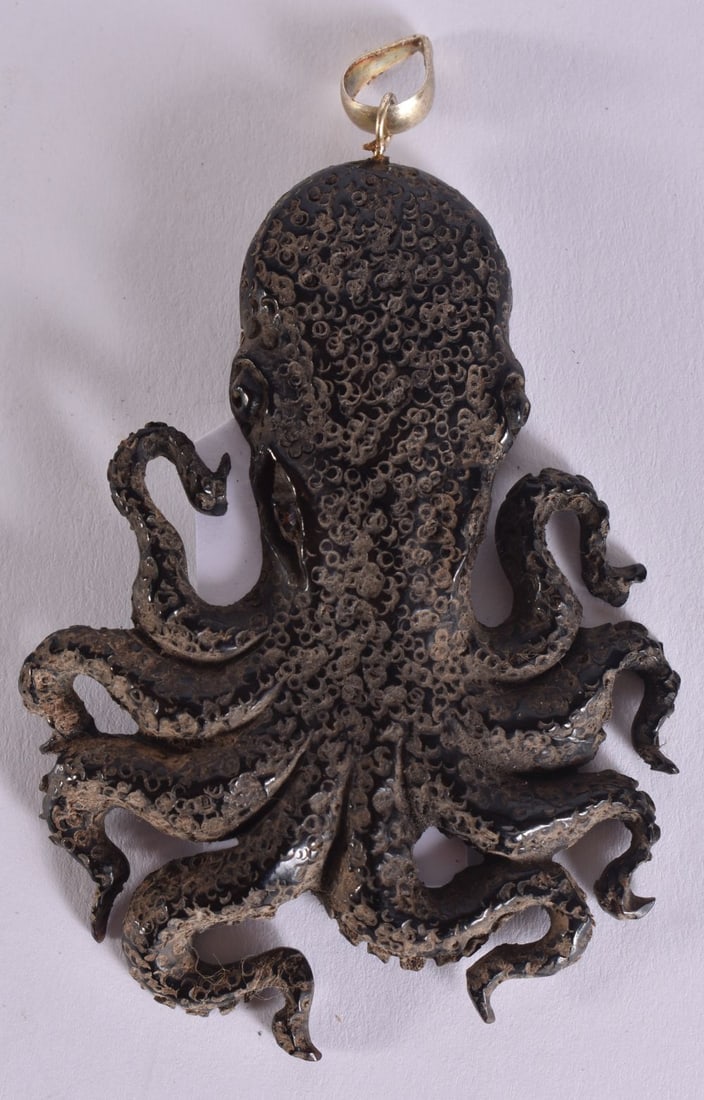 A JAPANESE CARVED HORN OCTOPUS PENDANT. 7.5 cm x 5.5 cm. (1 of 3)