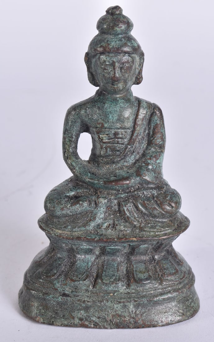 A TIBETAN BRONZE BUDDHA. 10 cm x 5 cm. (1 of 5)