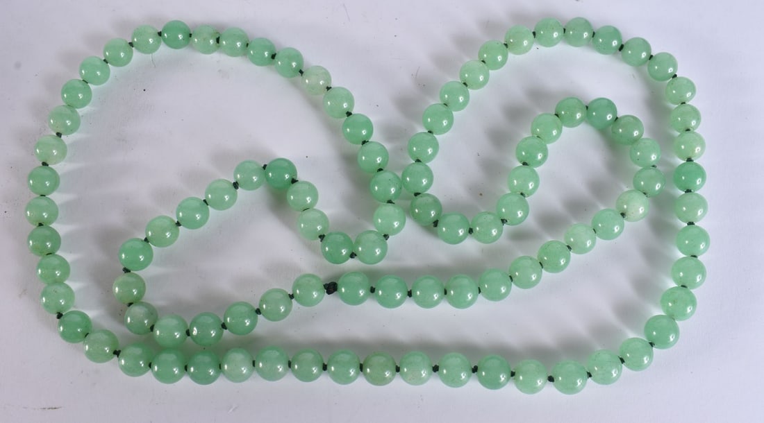 A CHINESE JADE NECKLACE. 118 cm long. (1 of 3)