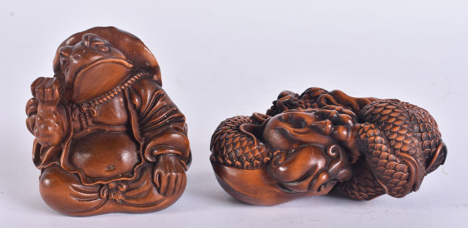 TWO JAPANESE WOOD CARVINGS. 6 cm wide. (2) (1 of 4)