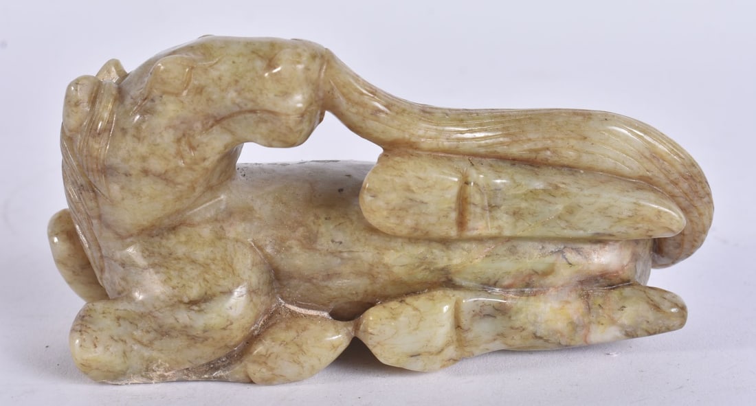 A CHINESE QING DYNASTY JADE HORSE. 10.5 cm wide. (1 of 3)