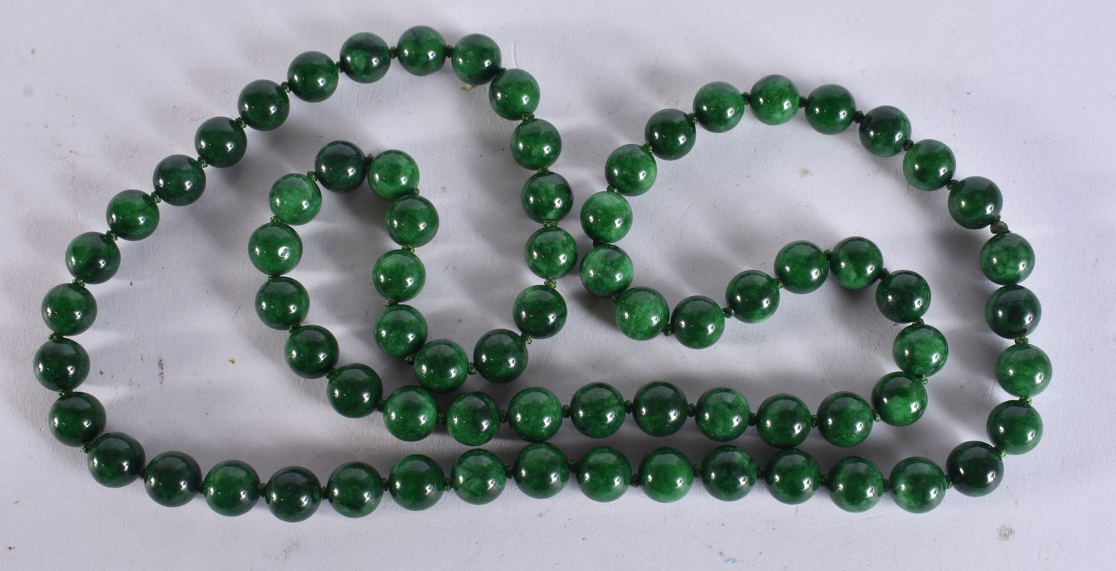 A CHINESE JADE NECKLACE. 80 cm long. (1 of 3)