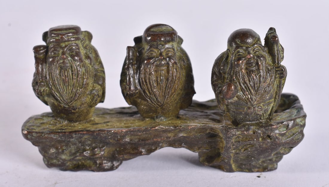 A CHINESE BRONZE OF THREE GODS. 8 cm wide. (1 of 3)
