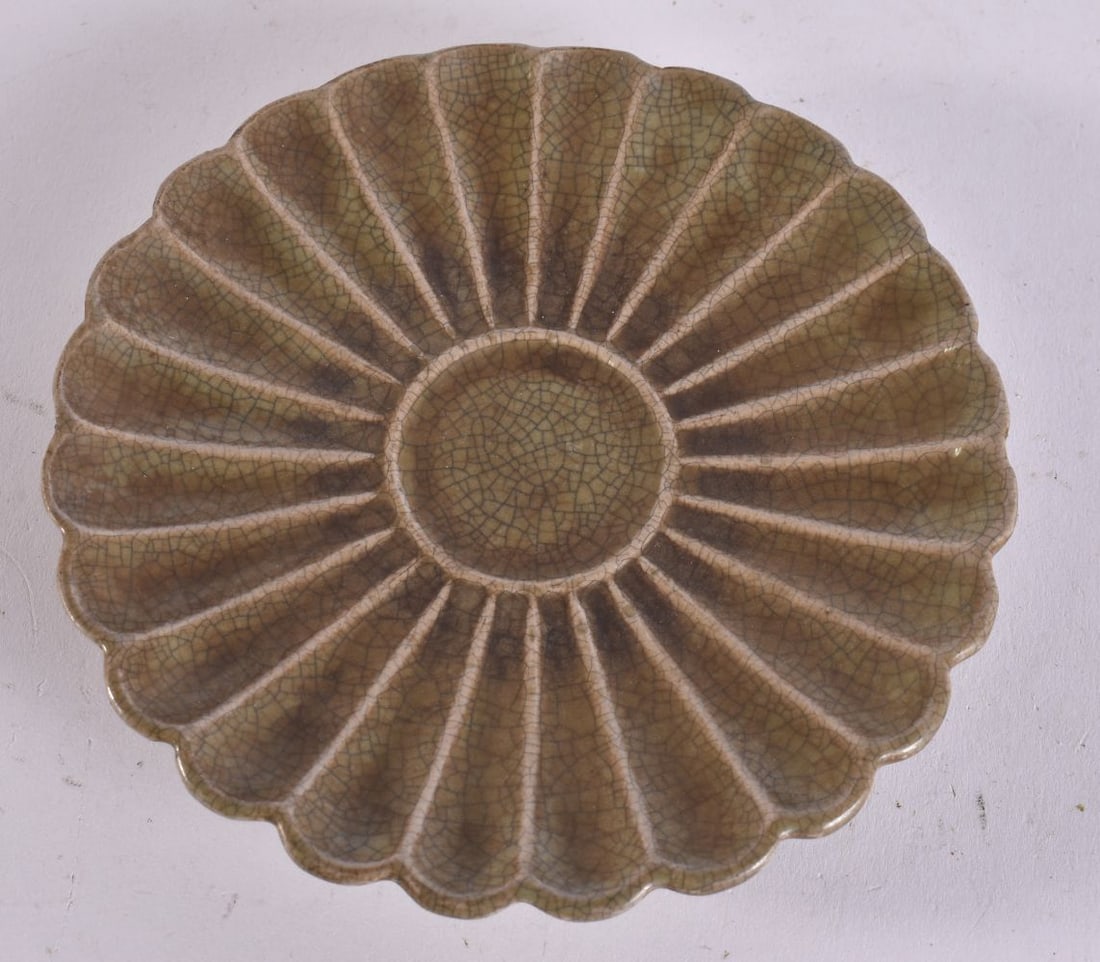 A CHINESE POTTERY SAUCER. 13 cm wide. (1 of 4)