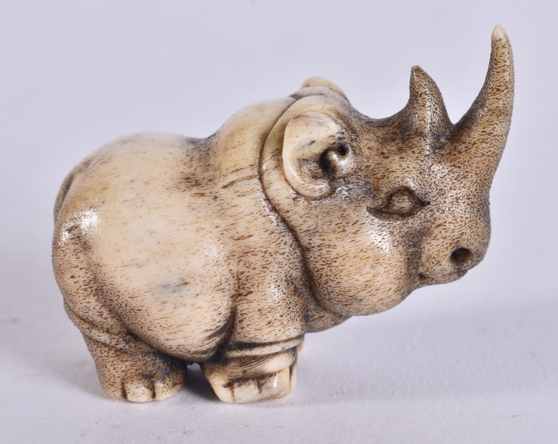 A JAPANESE CARVED STAG HORN RHINOCEROS. 5 cm wide. (1 of 4)