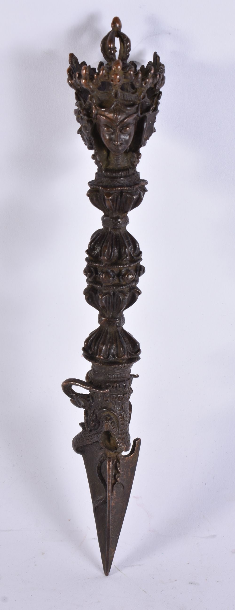 A TIBETAN BRONZE PHURBA. 19 cm long.: A TIBETAN BRONZE PHURBA. 19 cm long.