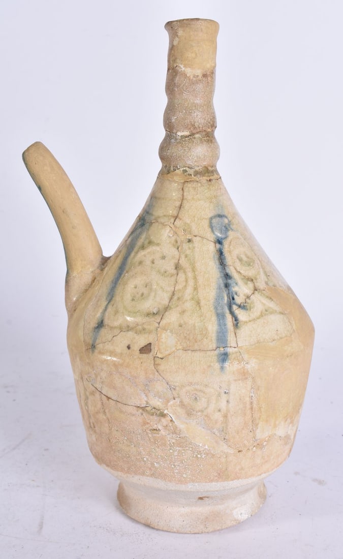 AN EARLY MIDDLE EASTERN POTTERY EWER probably 13th/14th century. 22 cm high. (1 of 6)