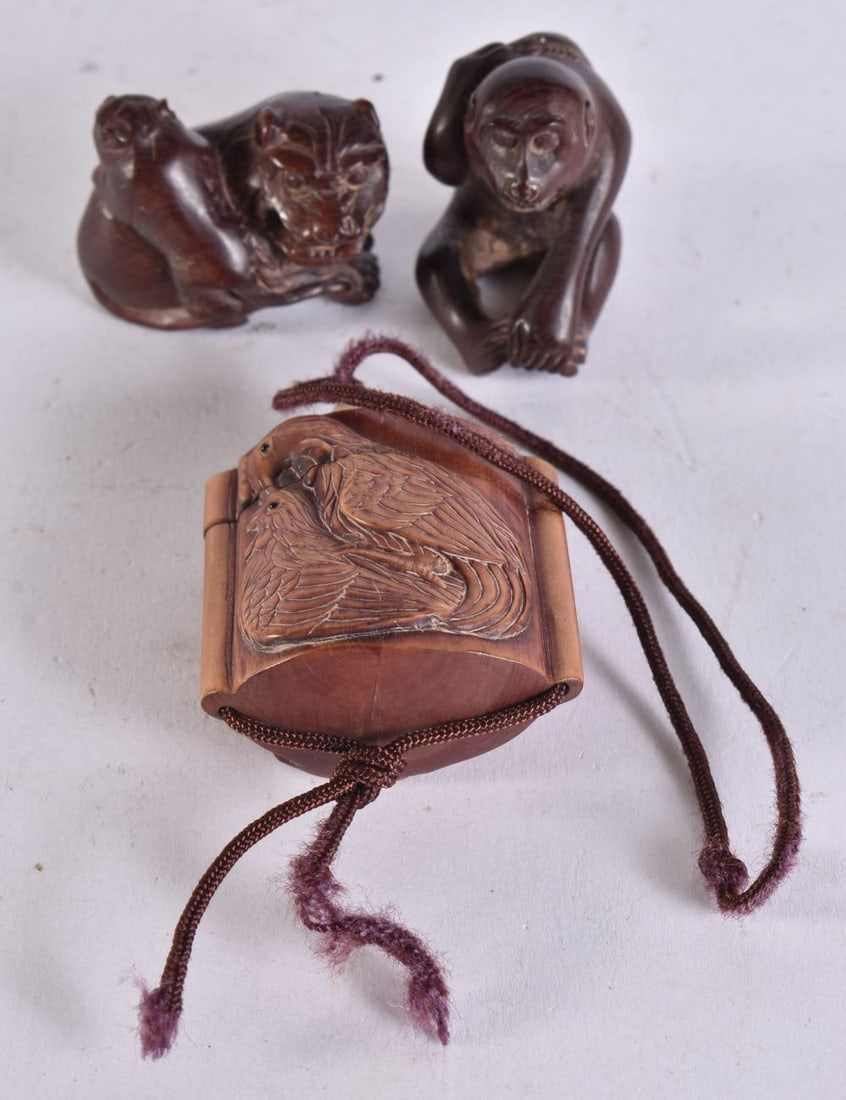 TWO JAPANESE WOOD NETSUKES and an inro. (3) (1 of 7)