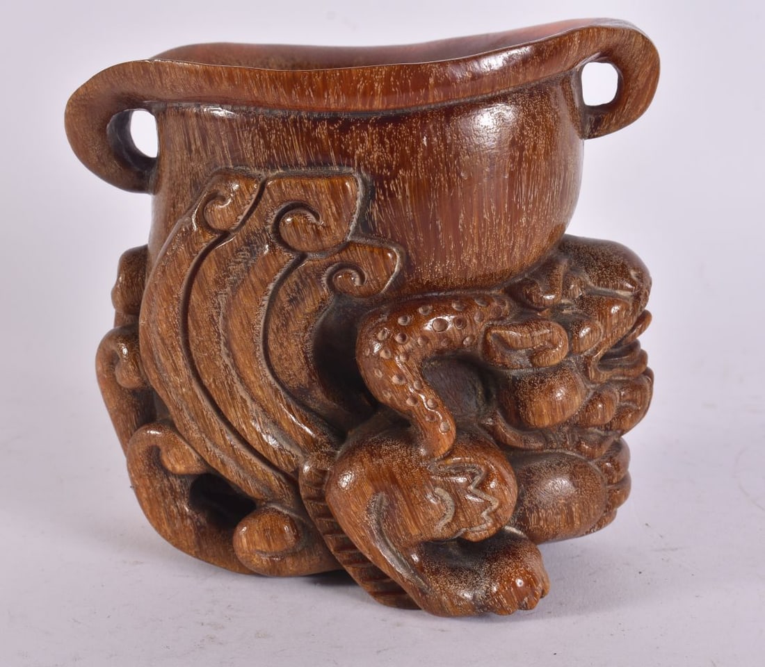 A CHINESE CARVED BUFFALO HORN TYPE LIBATION CUP. 13 cm x 13 cm.: A CHINESE CARVED BUFFALO HORN TYPE LIBATION CUP. 13 cm x 13 cm.