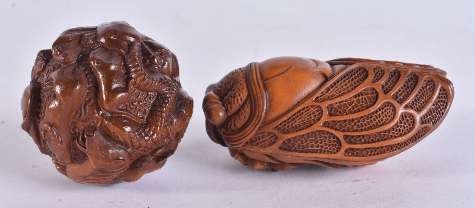 TWO JAPANESE WOOD CARVINGS. 6.5 cm wide. (2) (1 of 3)