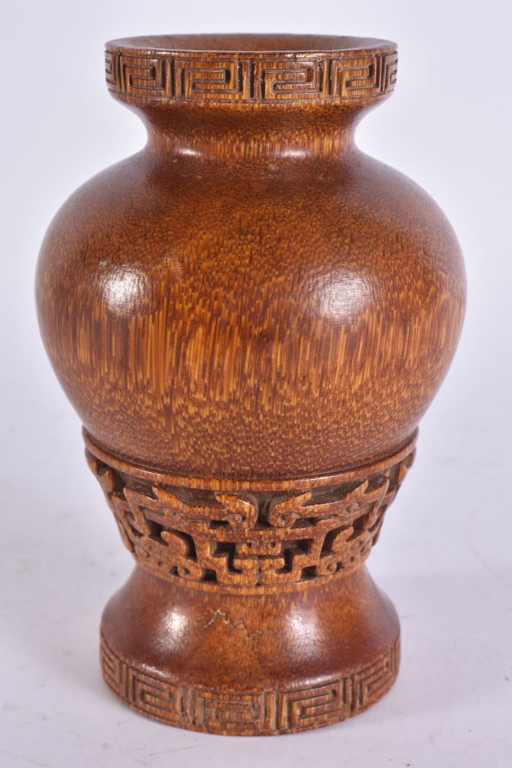 A CHINESE CARVED HORN TYPE LIBATION CUP. 15 cm high.: A CHINESE CARVED HORN TYPE LIBATION CUP. 15 cm high.