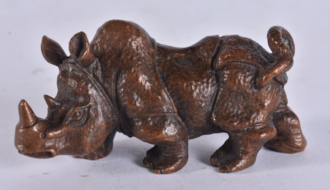 A JAPANESE BRONE RHINO. 7 cm wide. (1 of 3)