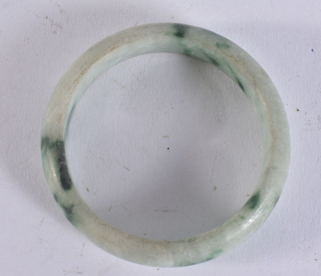 A CHINESE JADE BANGLE. 8 cm wide. (1 of 3)