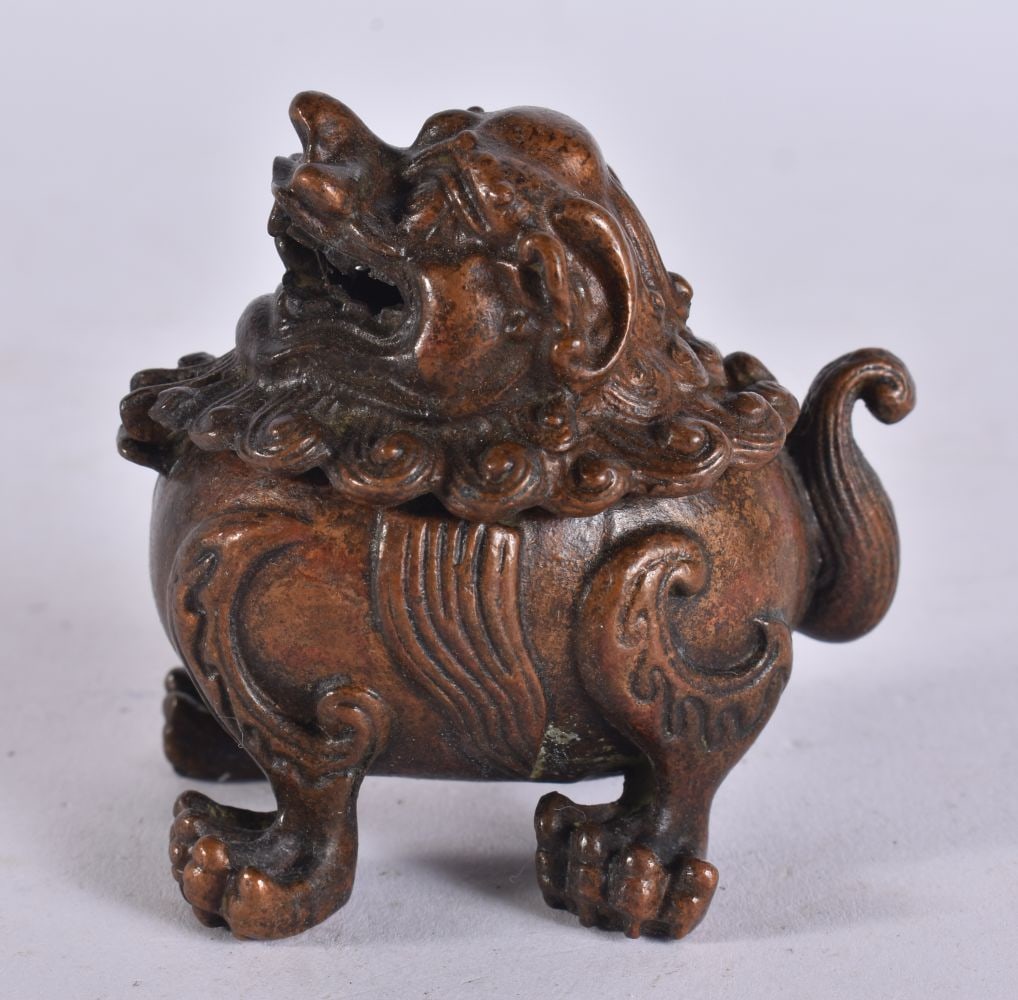 A CHINESE BRONZE FOO DOG CENSER. 6.5 cm wide. (1 of 4)