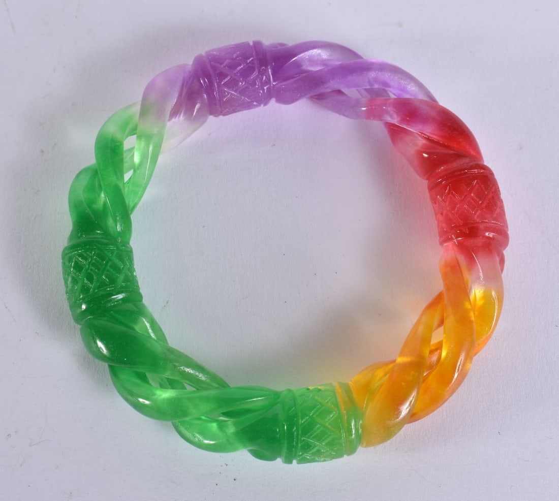 A CHINESE MULTI COLOUR JADE BANGLE. 8.5 cm wide. (1 of 3)