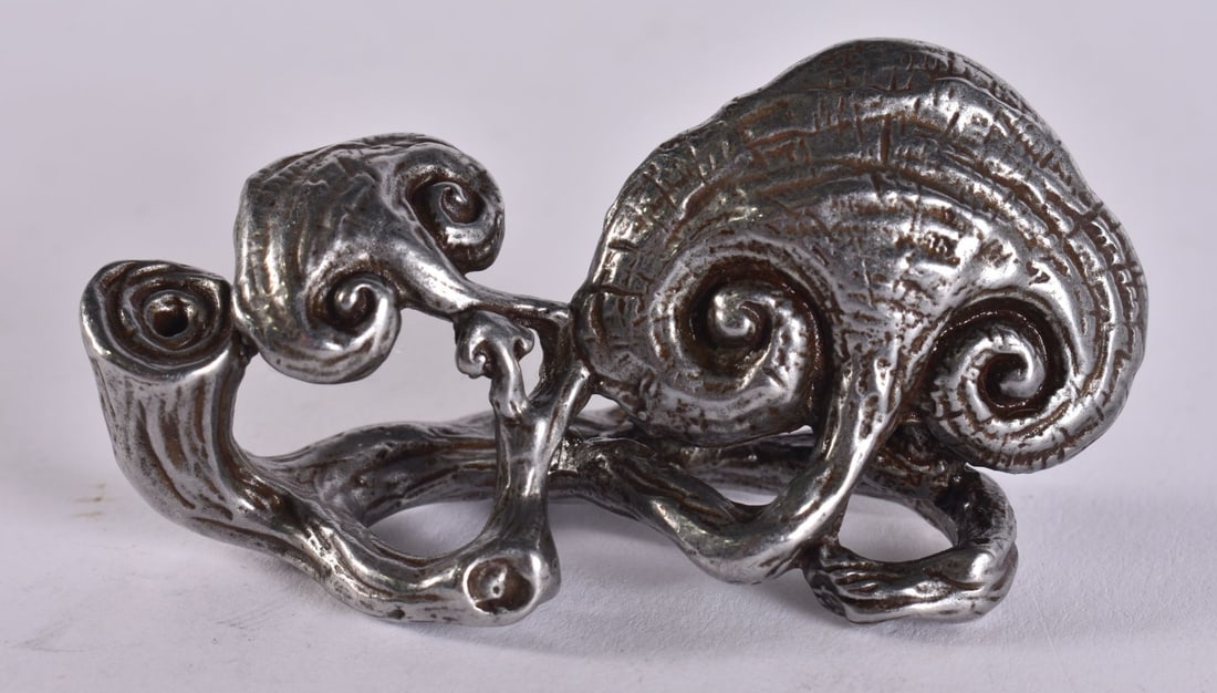 A CHINESE WHITE METAL LINGZHI FUNGUS. 7 cm x 3.5 cm.: A CHINESE WHITE METAL LINGZHI FUNGUS. 7 cm x 3.5 cm.