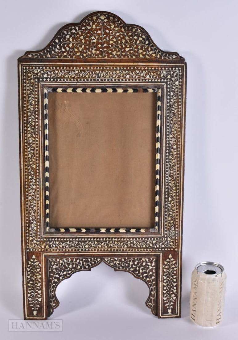 A LARGE 19TH CENTURY MIDDLE EASTERN BONE INLAID WOOD FRAME decorated with foliage. 58 cm x 28 cm. (1 of 4)