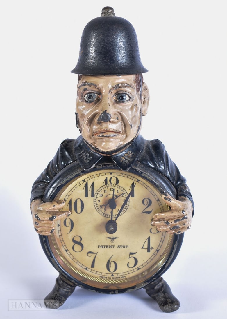 A VERY RARE EARLY 20TH CENTURY GERMAN POLICE OFFICER COLD PAINTED CLOCK. 22.5 cm x 10 cm. (1 of 6)