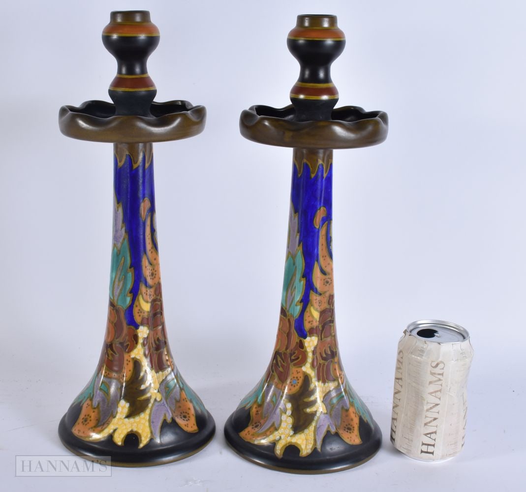 A LARGE PAIR OF DUTCH GOUDA POTTERY CANDLESTICKS painted with flowers. 38 cm high. (1 of 6)
