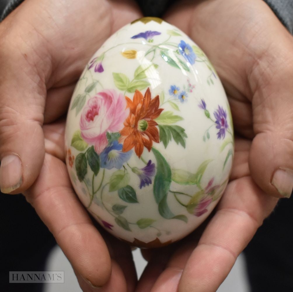 A RUSSIAN PORCELAIN PAINTED EASTER EGG decorated with floral sprays. 11 cm x 6.5 cm.: A RUSSIAN PORCELAIN PAINTED EASTER EGG decorated with floral sprays. 11 cm x 6.5 cm.