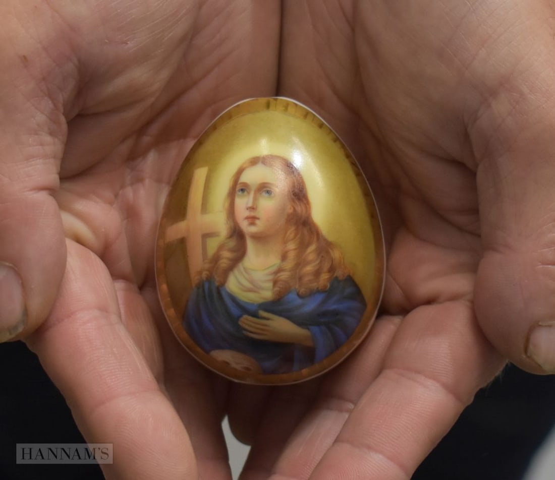 A FINE RUSSIAN PORCELAIN PAINTED EASTER EGG decorated with a saint within a gilded ground. 7 cm x 5. (1 of 4)