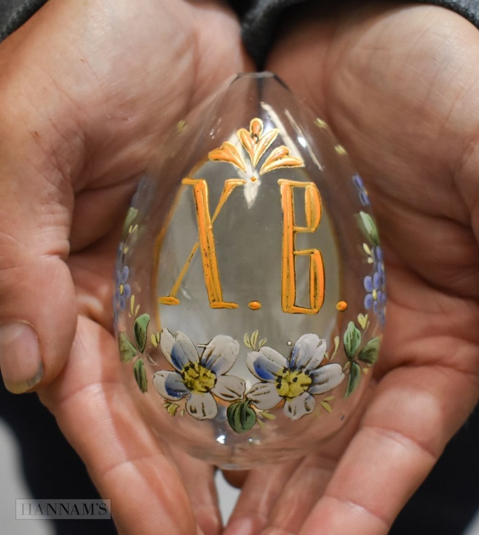 A RUSSIAN PORCELAIN ENAMELLED GLASS EASTER EGG decorated with flowers and a building. 10 cm x 6.5 cm (1 of 4)