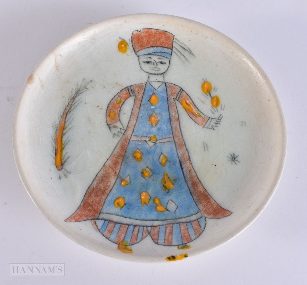 A SMALL TURKISH KUTAHYA FIGURAL POTTERY PLATE. 15 cm wide. (1 of 4)
