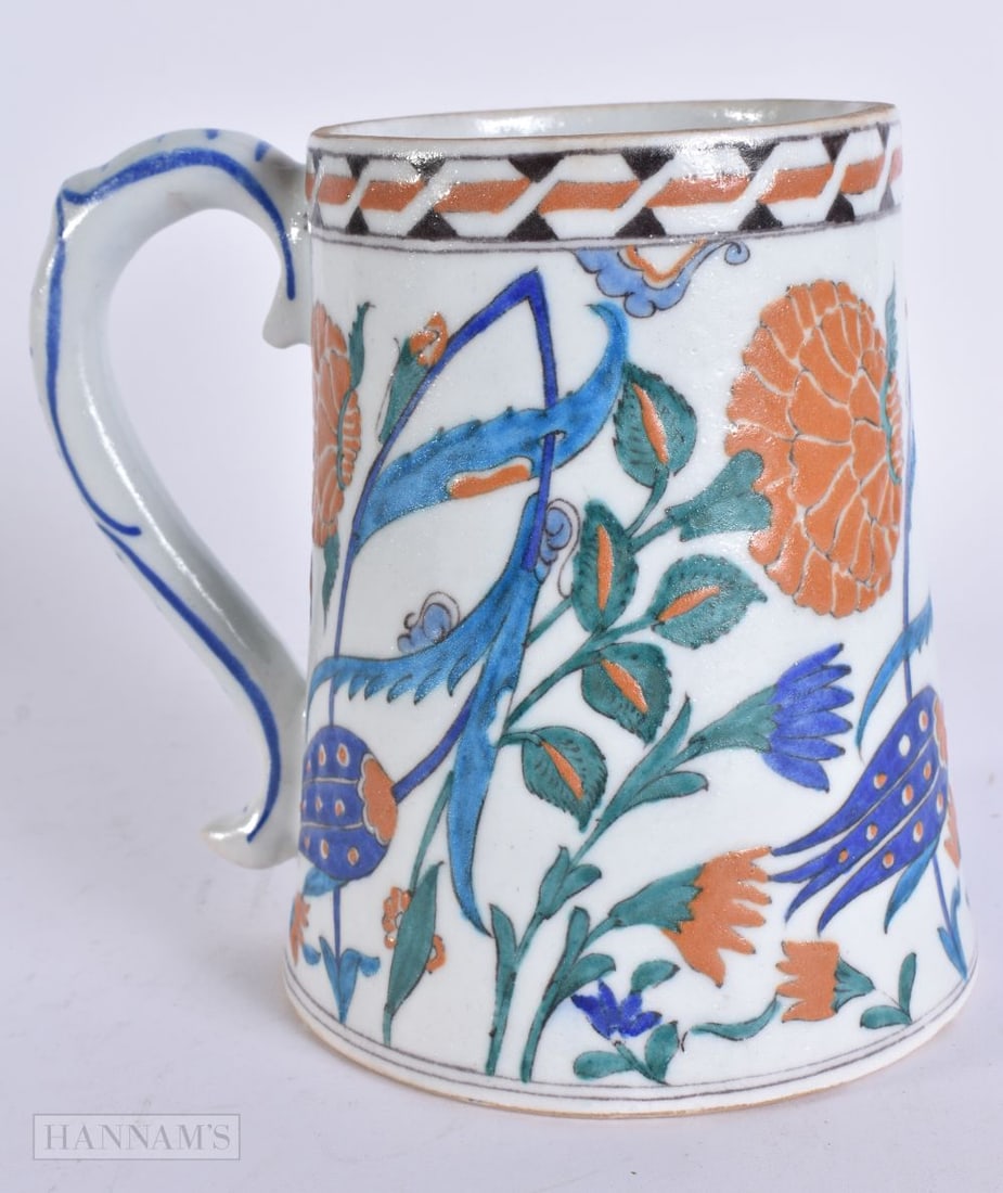 A TURKISH IZNIK POTTERY MUG. 15.5 cm high. (1 of 6)