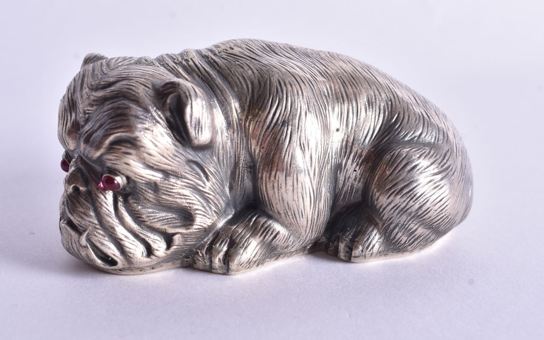 A Continental Silver Model of a Recumbent Dog. Stamped 84. 3.1cm x 3.5cm x 6.6cm, weight 59.4g: A Continental Silver Model of a Recumbent Dog. Stamped 84. 3.1cm x 3.5cm x 6.6cm, weight 59.4g