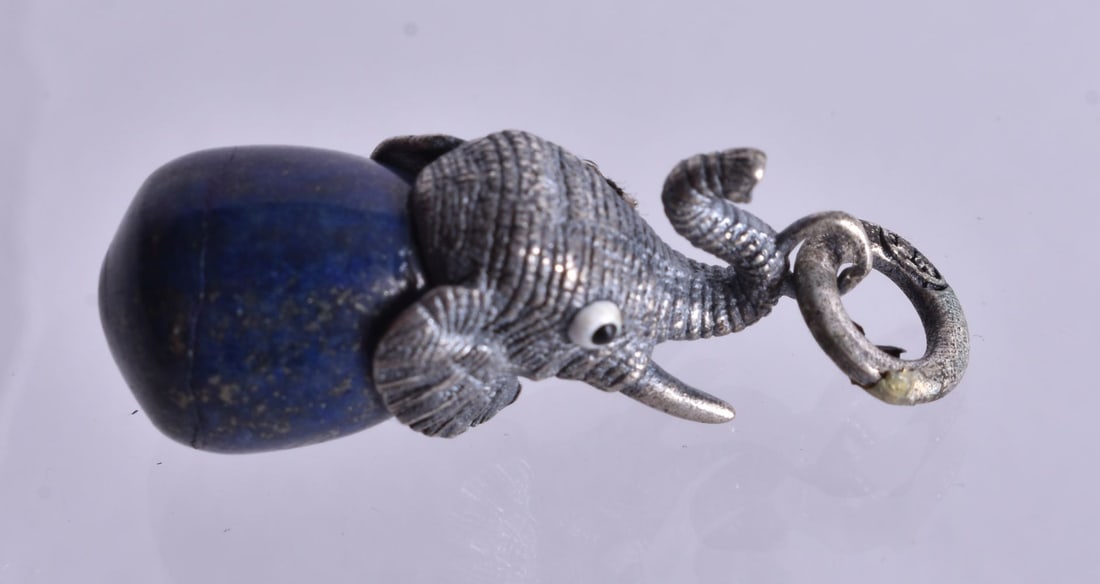 A Hardstone Pendant with a Continental Silver Elephant Mount. Stamped 84. 3cm x 1.1cm x 1.1cm, wei (1 of 3)