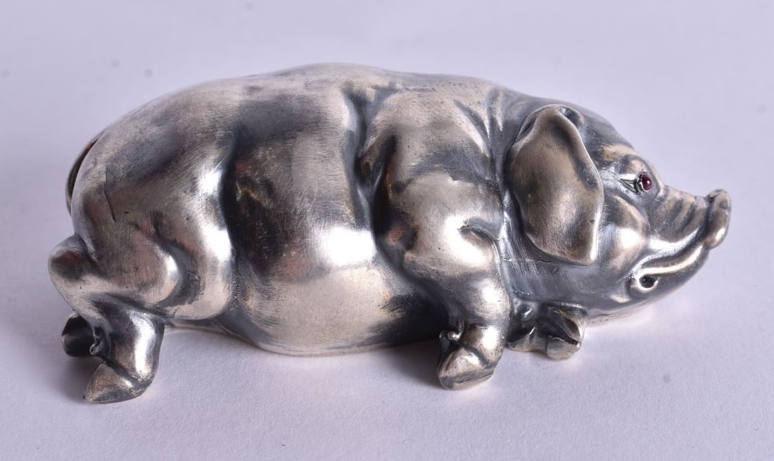 A Continental Silver Model of a Recumbent Pig. Stamped 84. 2.5cm x 7.1cm x 3.5cm, weight 42.5g: A Continental Silver Model of a Recumbent Pig. Stamped 84. 2.5cm x 7.1cm x 3.5cm, weight 42.5g