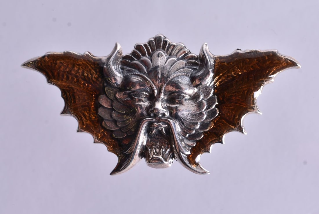 A Silver and Enamel Devils Head Brooch. Stamped Sterling. 2.7cm x 5.4cm, weight 8.9g (1 of 2)