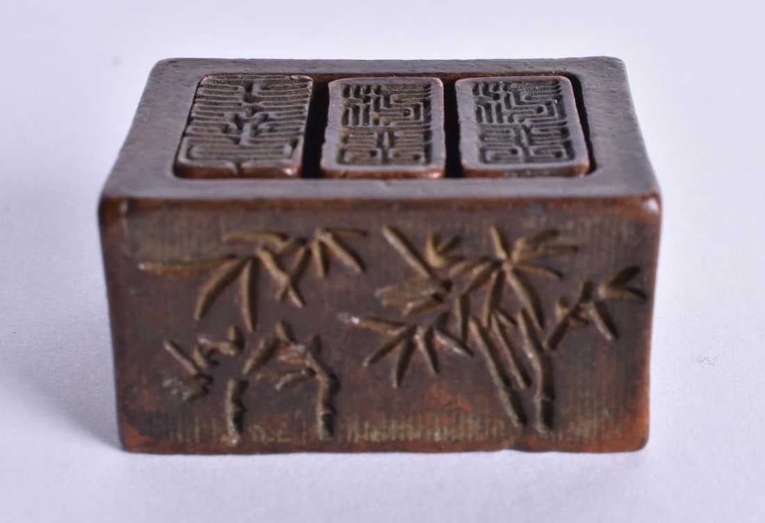 A Chinese Bronze Seal Set. 2cm x 2.8cm x 3.8cm (1 of 4)