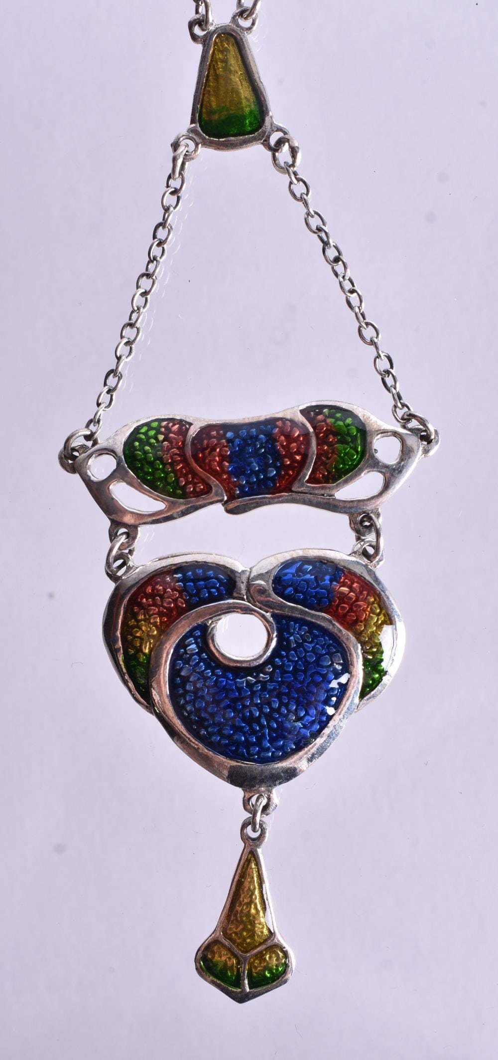 A Silver and Enamel Necklace in the Art Nouveau Style. Stamped Sterling. Chain 46cm long, Pendant: A Silver and Enamel Necklace in the Art Nouveau Style. Stamped Sterling. Chain 46cm long, Pendant 8.4cm x 3.2cm, weight 11.5g