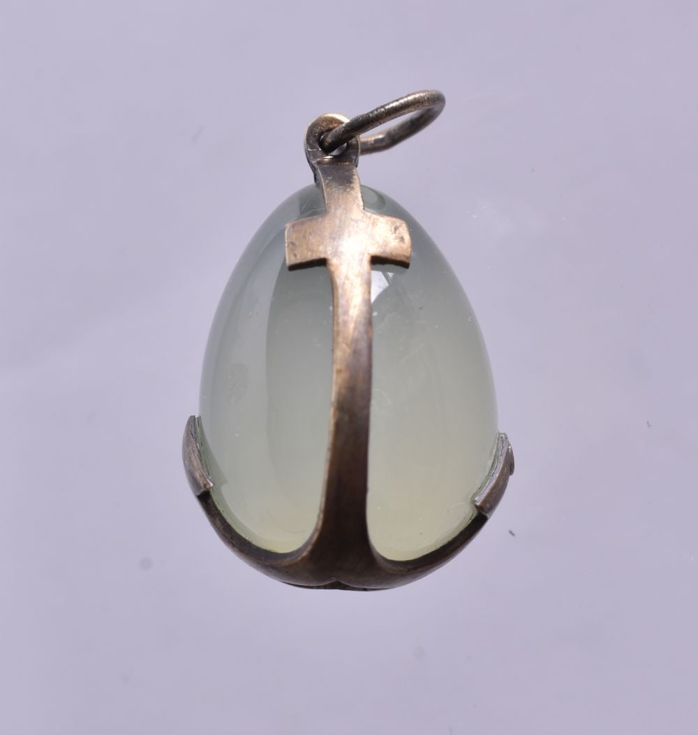 A Continental Silver Mounted Jade Pendant. Stamped 84. 1.9cm x 1.3cm, weight 4g: A Continental Silver Mounted Jade Pendant. Stamped 84. 1.9cm x 1.3cm, weight 4g