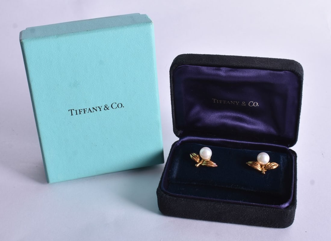 A Pair of Tiffany 18 Carat Gold Mounted Pearl Earrings in a fitted case with gift box. Stamped 750.: A Pair of Tiffany 18 Carat Gold Mounted Pearl Earrings in a fitted case with gift box. Stamped 750. 1.4cm x 2cm, weight 5.7g