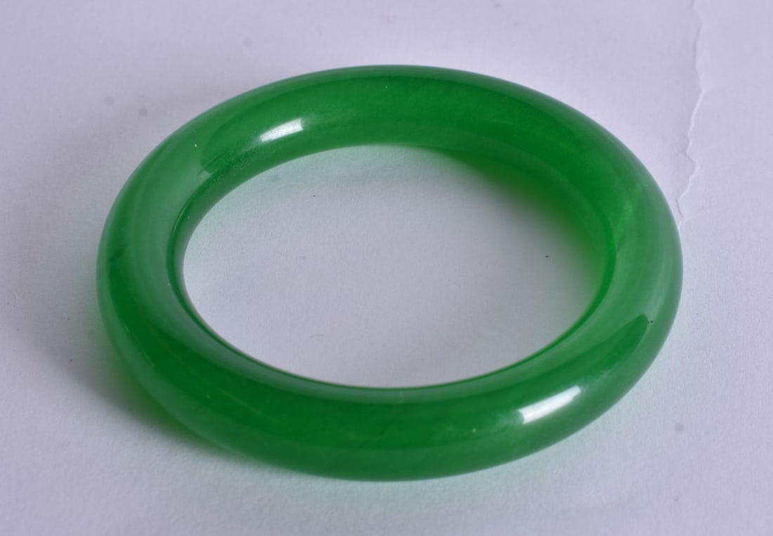 An Apple Green Jade Bangle. Internal Diameter 5.9cm (1 of 3)
