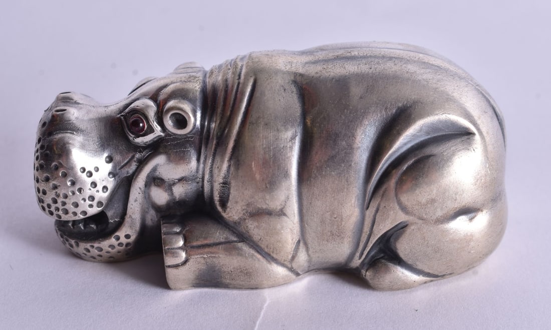 A Continental Silver Model of a Recumbent Hippo. Stamped 84. 3.6cm x 7.9cm x 3.8cm, weight 75.4g: A Continental Silver Model of a Recumbent Hippo. Stamped 84. 3.6cm x 7.9cm x 3.8cm, weight 75.4g