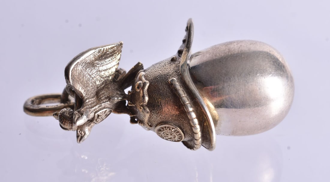 A Continental Silver Gilt Eagle atop a Helmet Mounted Egg Pendant. Stamped 84, 4.8cm x 2.3cm x 1.5c (1 of 3)
