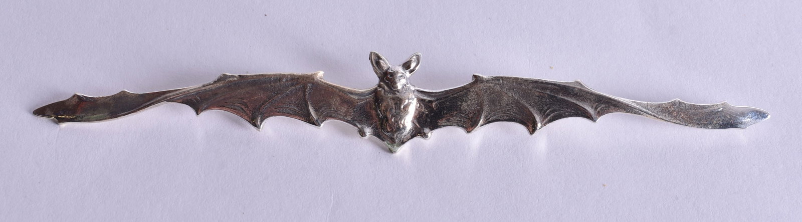A Silver Bat Brooch. Stamped Sterling. 11.6cm x 1.6cm, weight 8.2g: A Silver Bat Brooch. Stamped Sterling. 11.6cm x 1.6cm, weight 8.2g