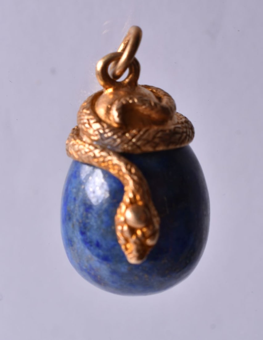 A Hardstone Drop Pendant with a Silver Gilt Coiled Snake Mount. Stamped 84 on Mount. 2.7cm x 1.9cm: A Hardstone Drop Pendant with a Silver Gilt Coiled Snake Mount. Stamped 84 on Mount. 2.7cm x 1.9cm x 1.7cm, weight 13.1g