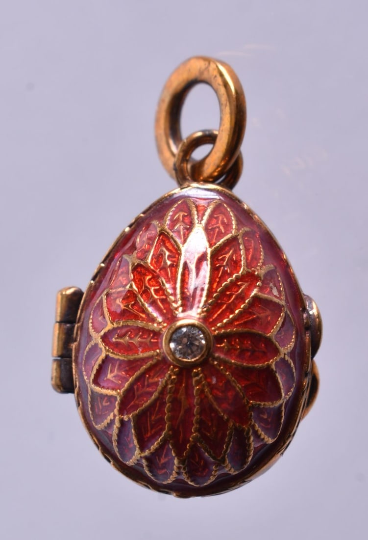 A Continental Silver Gilt and Red Enamel Egg Locket Pendant. Rubbed 84 Mark on Bail. 4.9cm x 1.5cm (1 of 3)