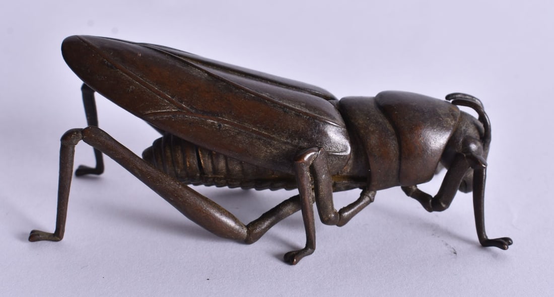 An Articulated Bronze Locust. 7.8cm x 3.8cm x 2.7cm (1 of 3)
