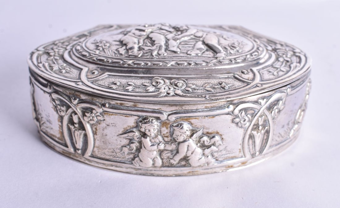 A Continental Silver Box with Heavily Embossed Cherub Decoration. French Marks 800. 9.7cm x 6.7cm x (1 of 4)