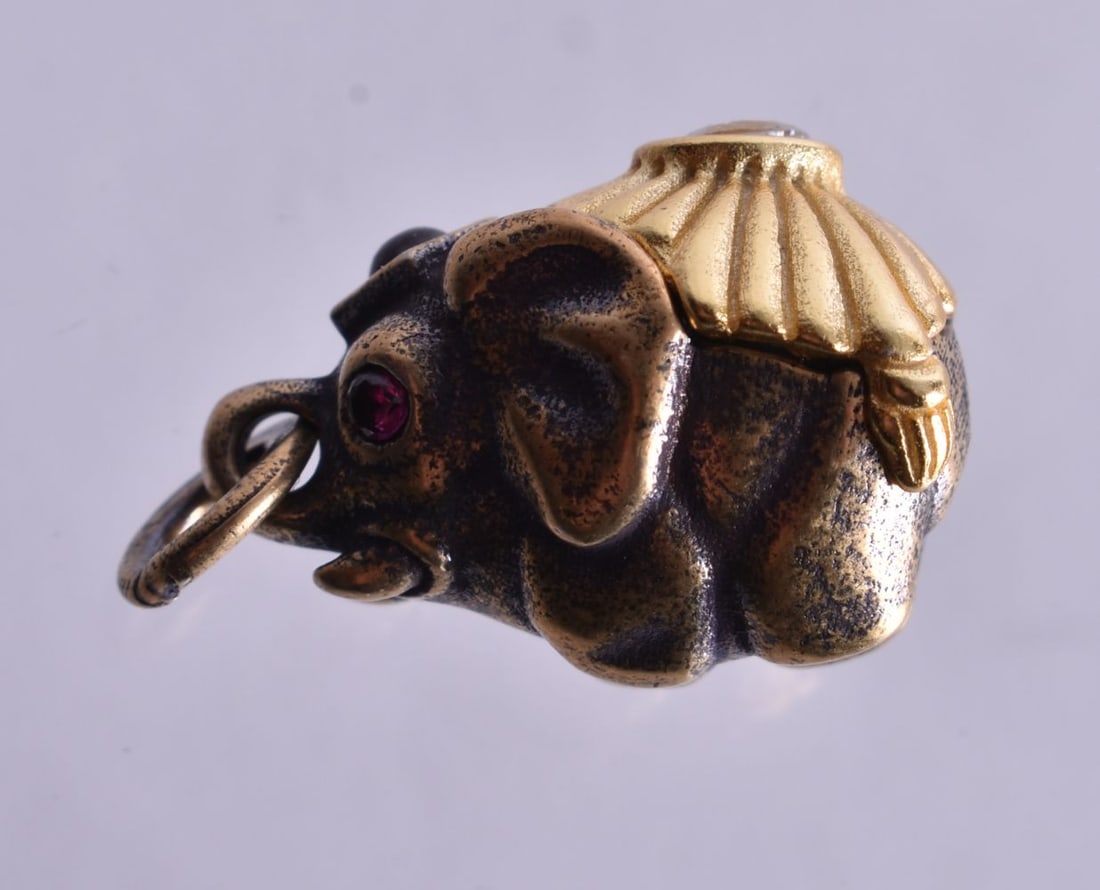 A Continental Silver Gilt Elephant Pendant. Stamped 84, 2.2cm drop, weight 6.8cm (1 of 4)