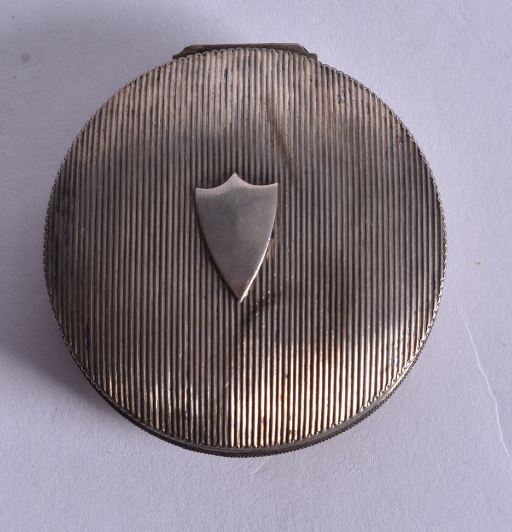 A Continental Silver Pill Box with Engraved Decoration. French Marks. 1.8cm x 4.4cm, weight 19g (1 of 4)