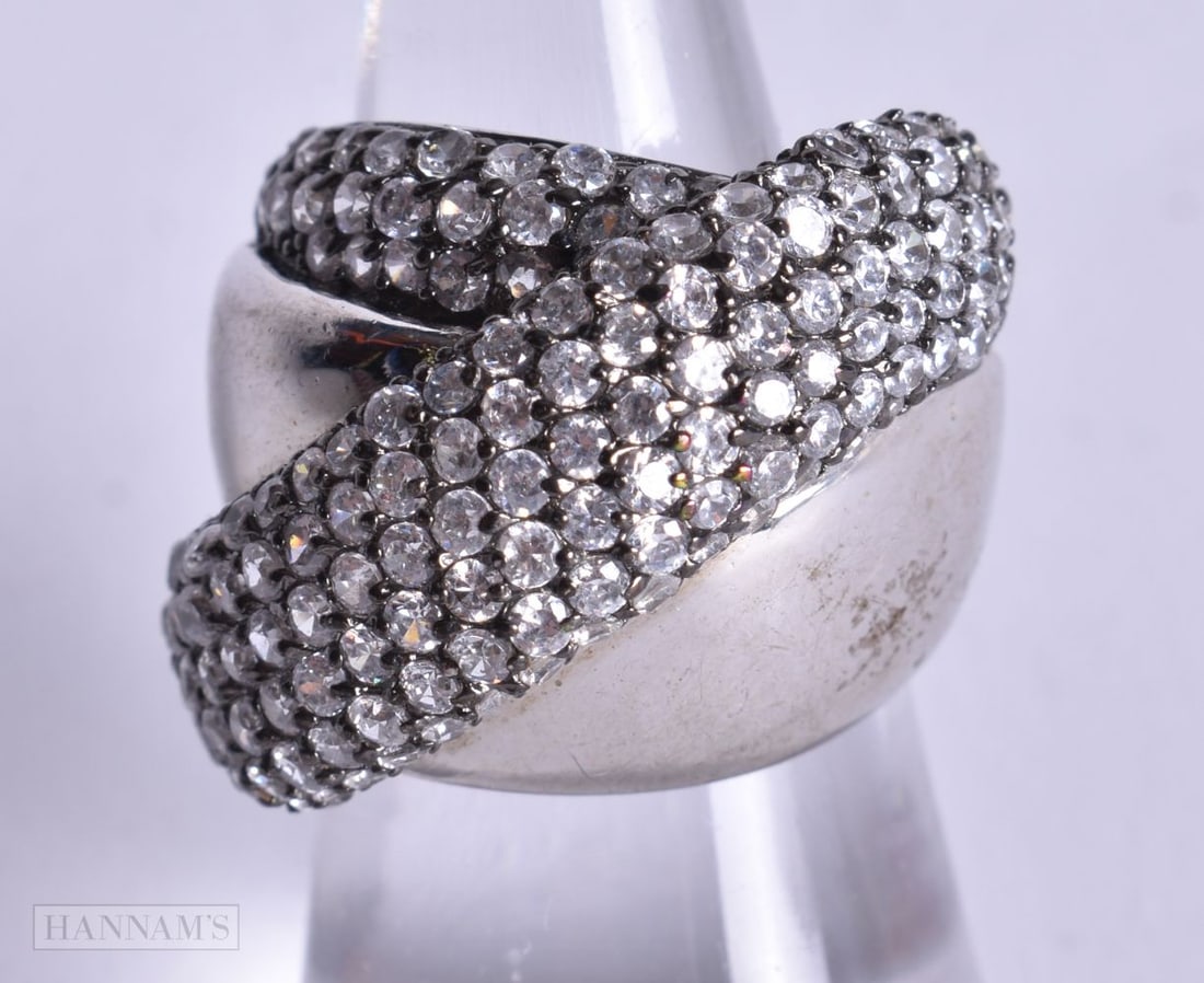A Silver and CZ Ring. Stamped 925, Size M, weight 11.8g (1 of 4)
